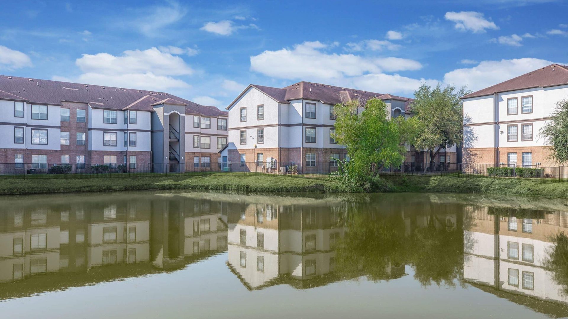 a large body of water surrounded by houses